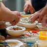Group of people mixing ingredients in a workshop setting